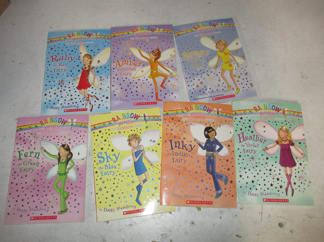 Cover of The Rainbow Magic Fairies (Original) Complete Set 1-7: Ruby the Red Fairy, Amber the Orange Fairy, Saffron the Yellow Fairy, Fern the Green Fairy, Sky the Blue Fairy, Inky the Indigo Fairy, & Heather